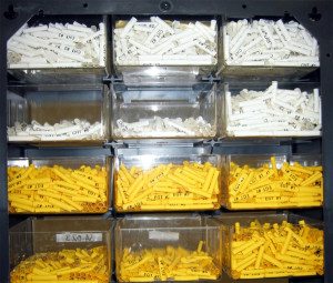 a collection of heat-shrink tubing stored in bins